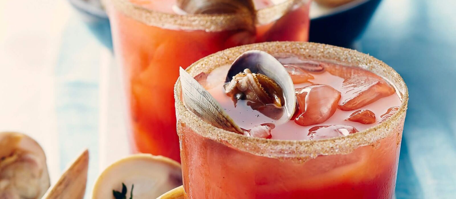 caesar drink with clams and ice in short glass