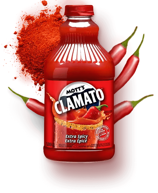 Mott's Clamato Bottle Extra Spicy Flavour with red spice powder and red spicy peppers behind it